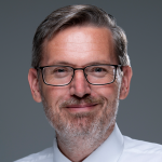 Picture of Jeffrey St. John. Link to UMS Unified Accreditation website (External Site).