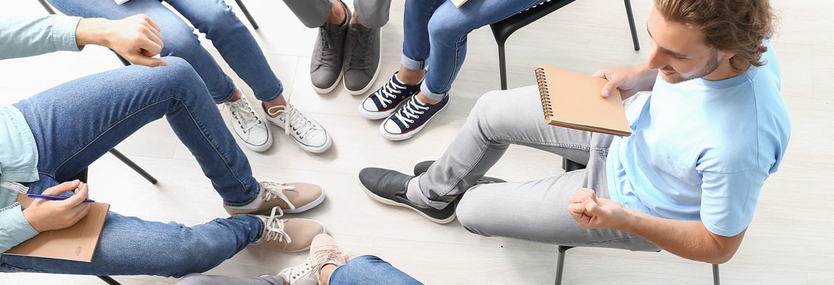 Substance Abuse Rehabilitation Technician working with clients in group therapy