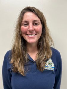 Headshot of Sara Bickford, a smiling woman, wearing a blue shirt with the logo for Somerset Emergency Management Agency