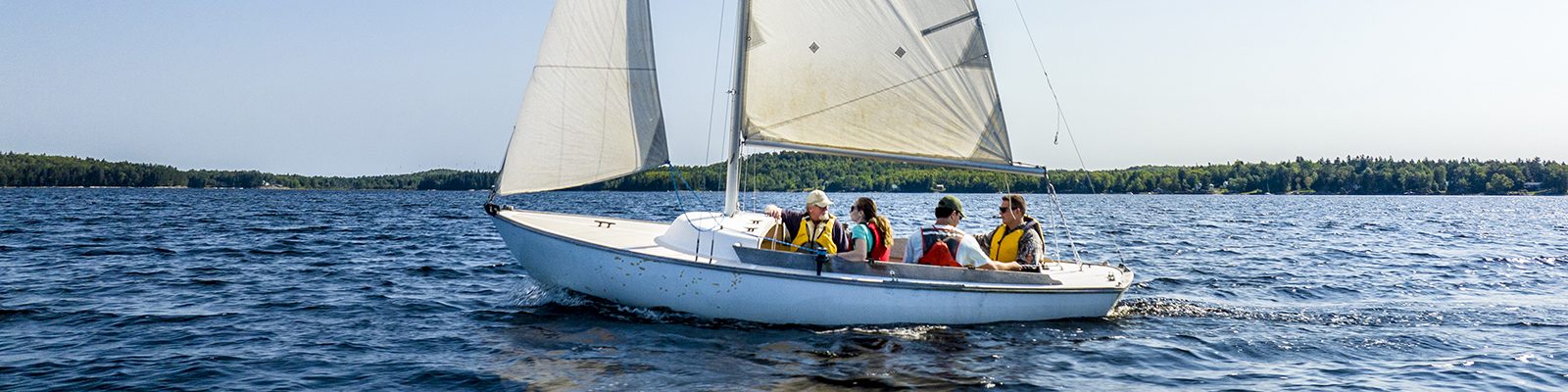 UMaine Machias students take advantage of the school's Sailing Class out on Gardner Lake on a lovely late summer's day in East Machias.