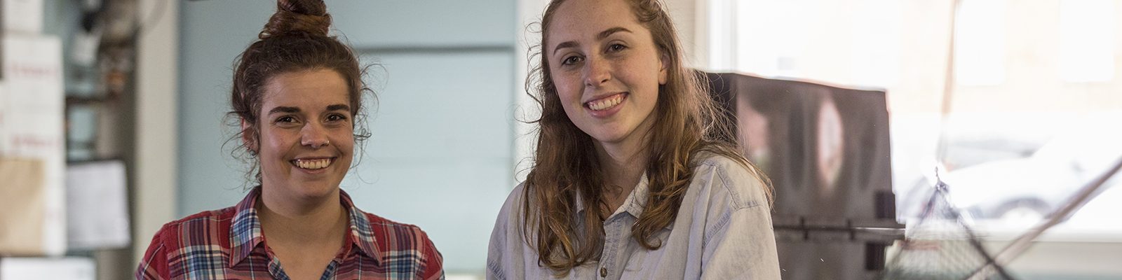 Two students smiling for a photo
