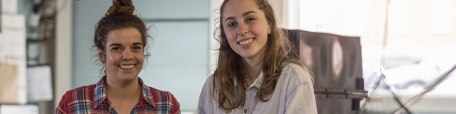 Two students smiling for a photo