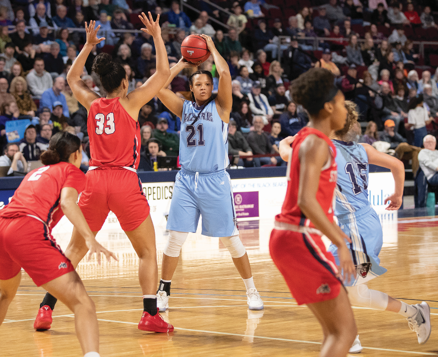 group of student athletes playing basketball 