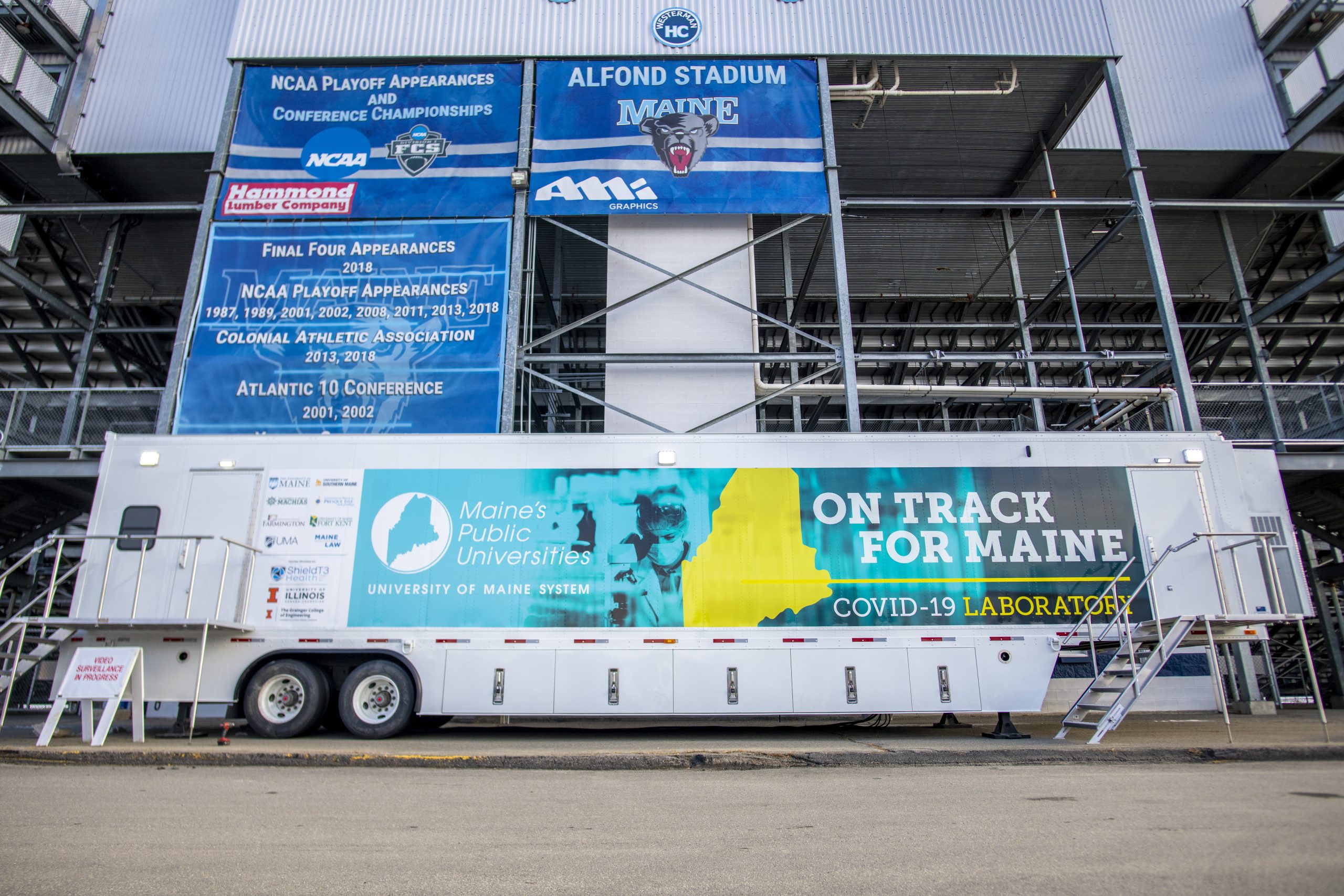 Photo of a mobile COVID-19 testing lab outside of Alfond Stadium at the University of Maine.