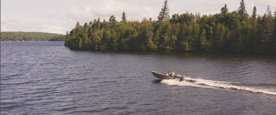 boat traveling fast in river